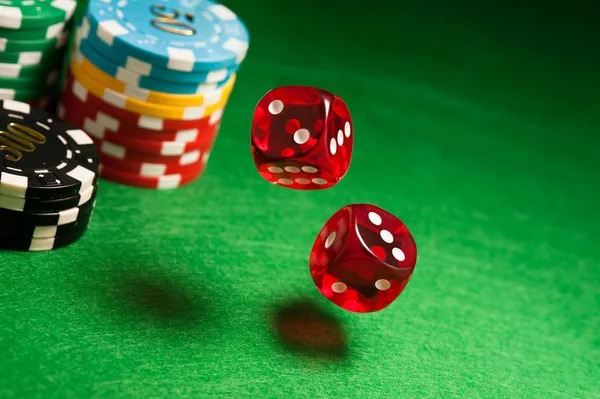 Mobile phone showing emaswangi app with live casino tables and betting options